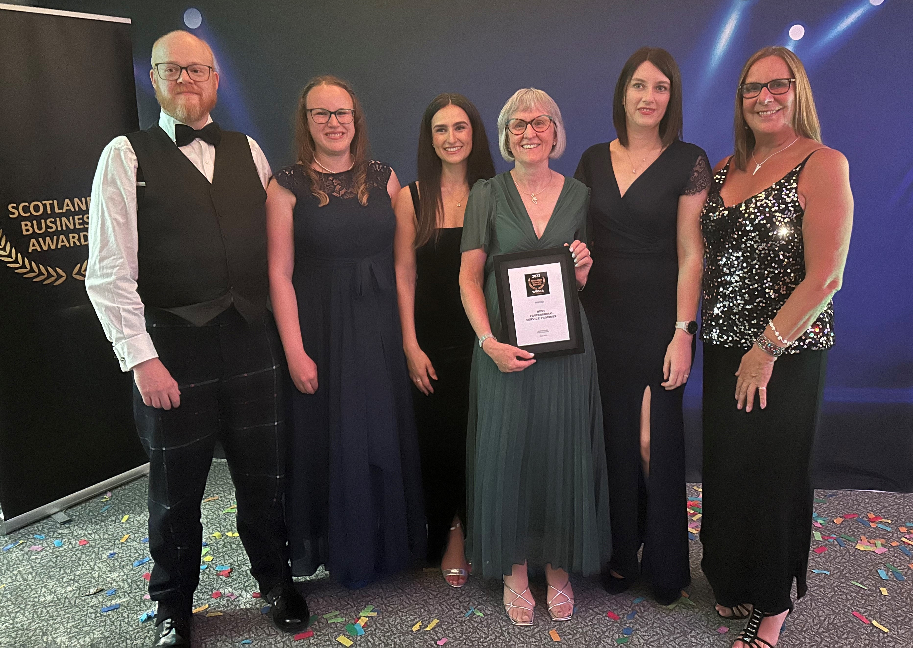 Rach Optometrists Staff collecting award