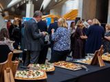 Guests networking beside catering table